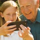 Elderly man and his Grand Daughter taking selfies - VideoHive Item for Sale