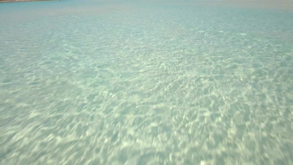 Aerial drone view clear water, houses on tropical island beach and coast in the Bahamas, Caribbean. 