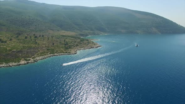 Boat in water next to mainland