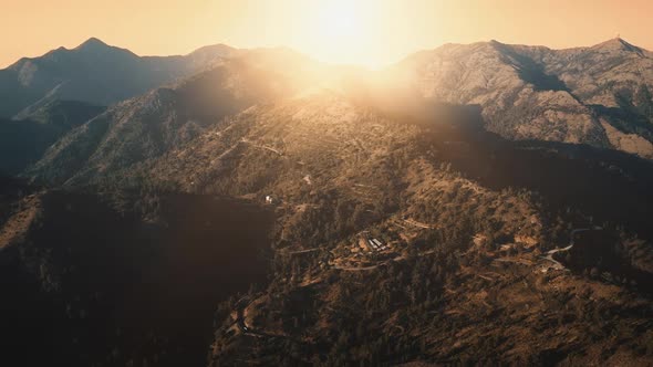 Orange Sunset Over Mountain Highland Village in Alps