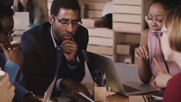 African American Employees Brainstorm Together at Office Meeting. Multiethnic Business People