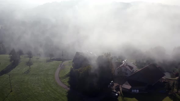 Village houses hidden in mysterious fog