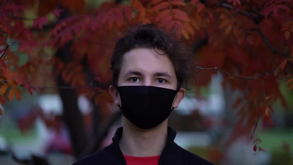 Portrait of a Teen in the City Streets During the Day, Wearing a Face Mask Against the Second Wave