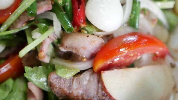 Close Up Footage of Thai Style Hot and Sour Grilled Beef Salad With Herbs and Garlic Pickle