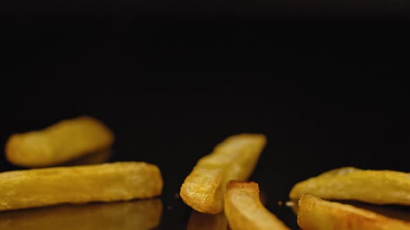 Close Shot of Chips Falling Onto a Hard Surface.