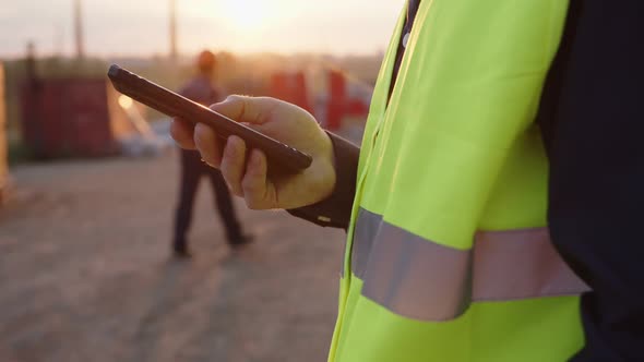 Close Up Man's Hand That Hold His Black Phone