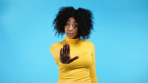 Mixed Race Woman Disapproving with NO Hand Sign Gesture