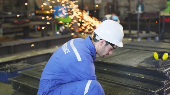 caucasian male engineer technician worker wearing safty blue helmet and uniform