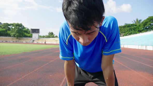 Sportsman Resting After Running At The Stadium