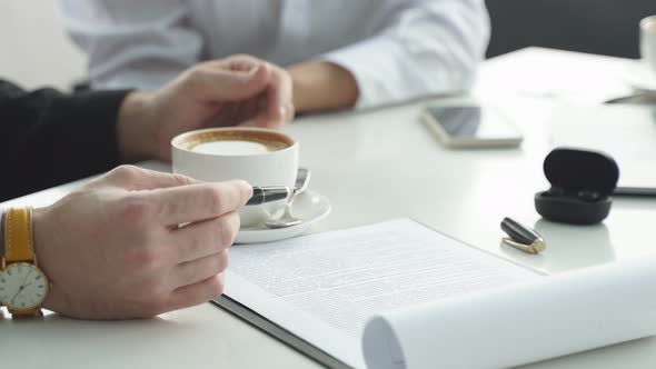 Business Lunch in a Cafe at a Table a Man and a Woman Closeup of Male and Female Hands Without a