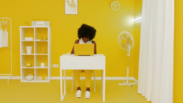 Black Woman In Yellow Room