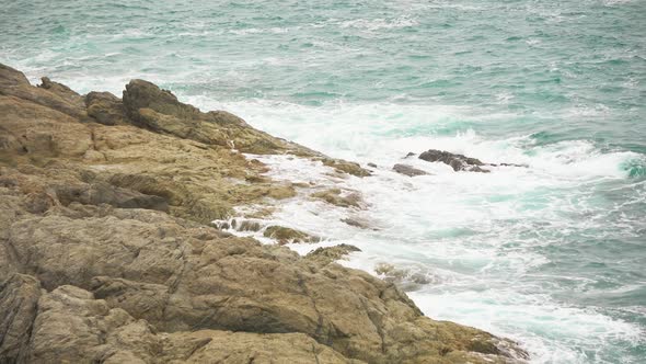 Sea Waves Break on The Rocky Shore. Foaming Water, the Restless Sea