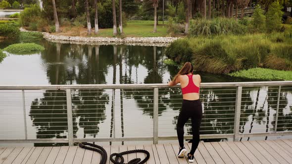 Aerial shot of a woman working out in the park