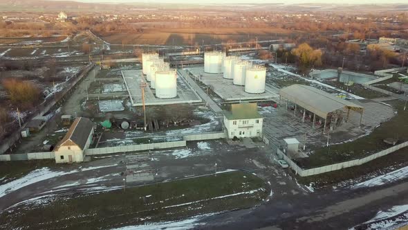 Aerial footage of big fuel reservoires in petrol industrial zone.