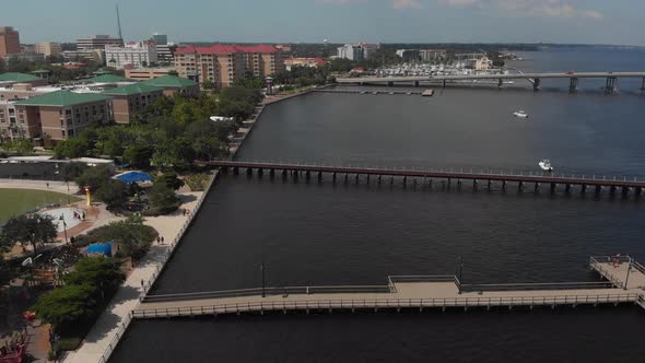 Aerial of Downtown Bradenton, Florida river walk.  Child area and fishing pier in focus. A great wal