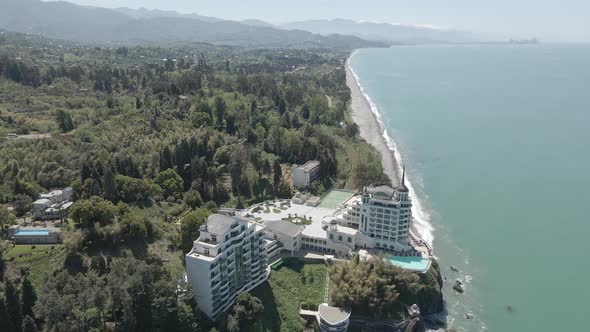 Aerial view of Georgian railway high speed train moving near the sea