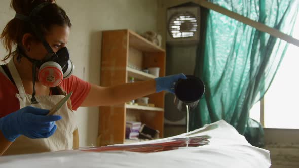 Woman making surfboard 4k