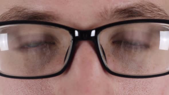 Close Up of Blinking Handsome Eyes of Man in Glasses