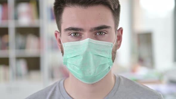 Close Up of Young Man with Protective Face Mask 