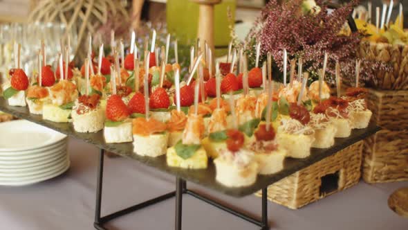 Beautifully Decorated Catering Banquet Table with Snack Canape in Restaurant or Hotel