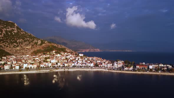 Urban Life of Coastal City with Cars Driving Along the Shore of Lake Egirdir Filmed By Drone