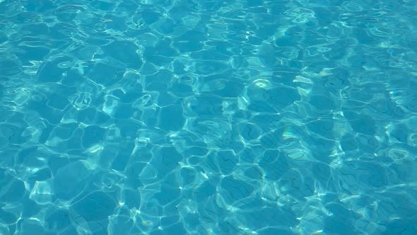 Calm Blue Wave Water of Pool. Close Up. Slow Motion.