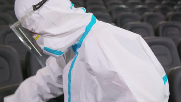 Worker Cleaning with Disinfectants for Chairs