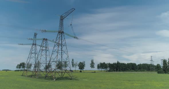 Transportation of Electricity Power Line Near the Highway Industrial View on the Line of Electric