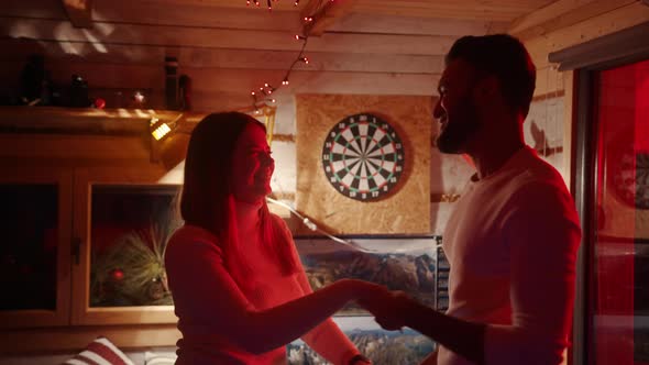 Happy Young Couple Dancing and Celebrating Anniversary