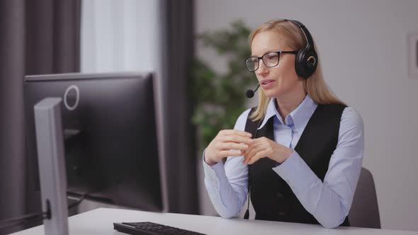 Woman Having Video Conference at Home