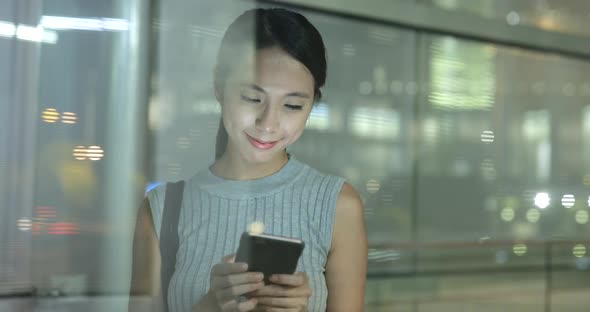 Woman use of smart phone in city 