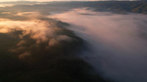 4K Drone Flying in the clouds. Flying through the clouds during sunrise