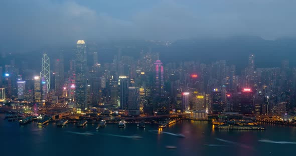 Day To Night Timelapse of Illuminated Hong Kong Skyline. Hong Kong, China