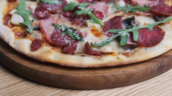 Appetizing Pizza on a Wooden Board in a Restaurant