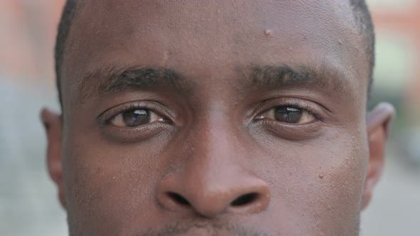 Close Up of Blinking Eyes of African Man