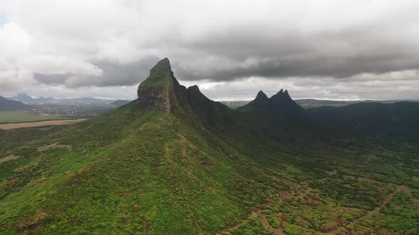 Shooting From Top to Bottom the Peaks of Mountains and Jungles of Mauritius the Sky in Clouds