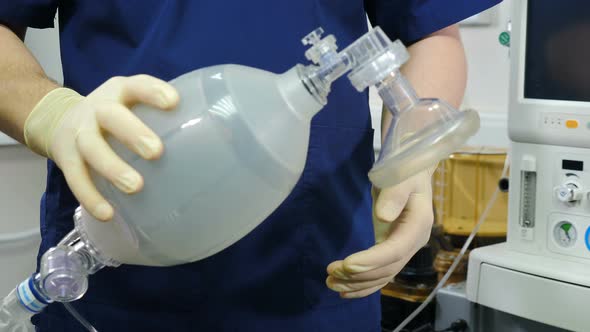 Anesthesiologist with Resuscitation Breathing Bag or Ambu Bag in Hands