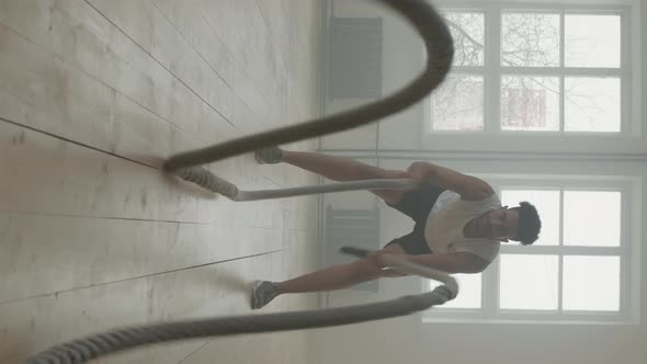 Afro-American Man Exercising With Battle Rope