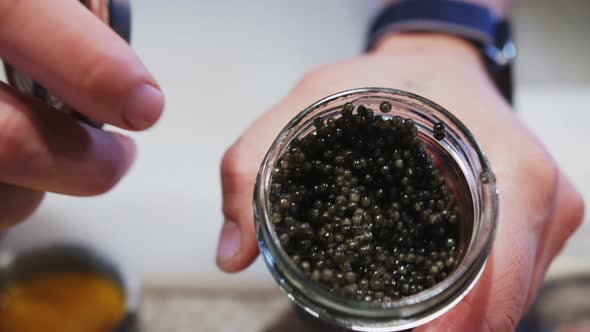 open can of black caviar