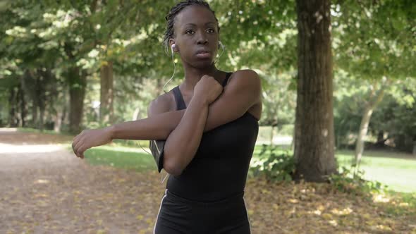 attractive black woman doing stretching before running. Concentration,sport