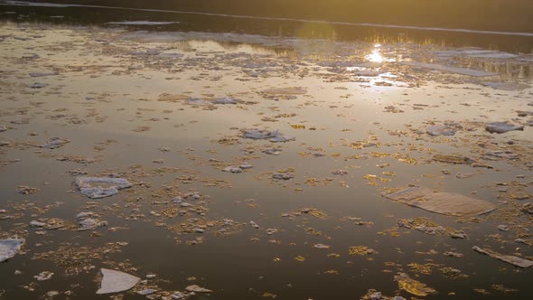 Ice Drifting on the Volga River in Spring at Sunset Ice Floes Floating on Water