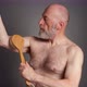 senior man is practicing dry brushing - VideoHive Item for Sale