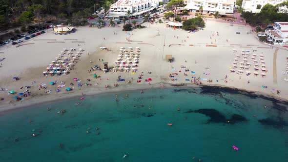 Aerial footage of the Spanish island of Ibiza showing the beautiful beach front and hotels