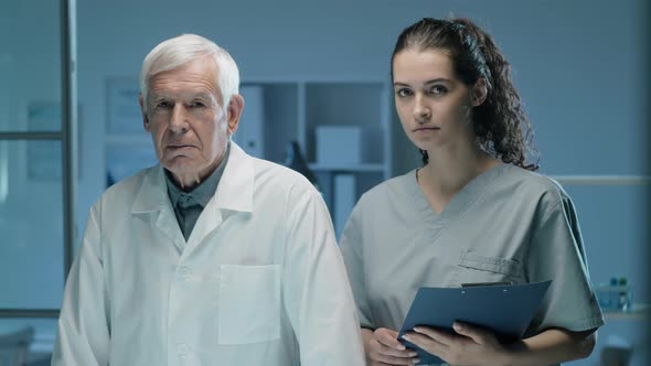 Portrait of Senior Scientist and Young Female Assistant in Lab