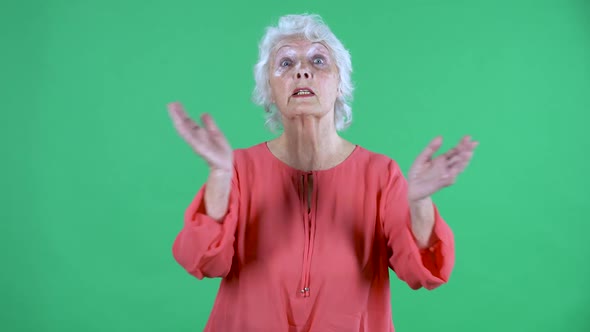 Portrait Elderly Woman Looking at the Camera with a Shocked Frightened Expression and Emotionally