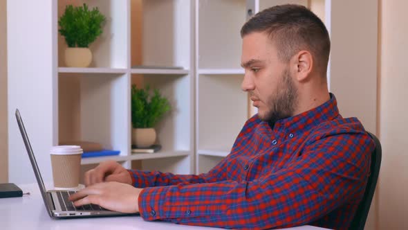 Men Working at Home Typing on Computer