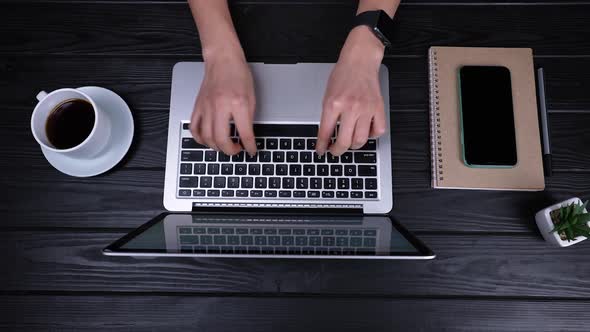 Top View of the Girl's Hands Who are Typing on an Open Laptop Writing Emails Browsing the Internet