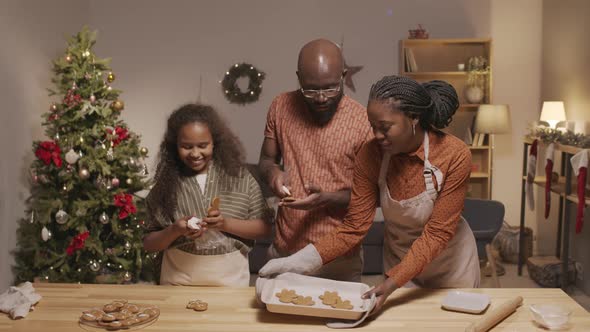 African-American Family Making Gingerbread Cookies for Christmas