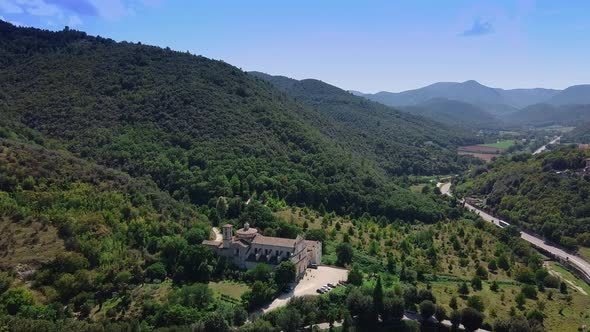 Awesome Aerial View of Mountainous Landscape with City Suburbs and Green Forests