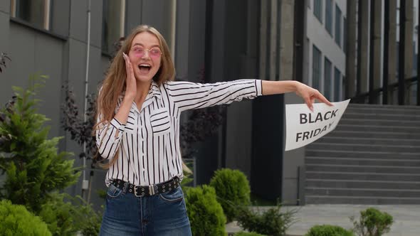 Excited Teen Girl Showing Black Friday Inscription, Advertising Discounts, Showing Thumbs Up